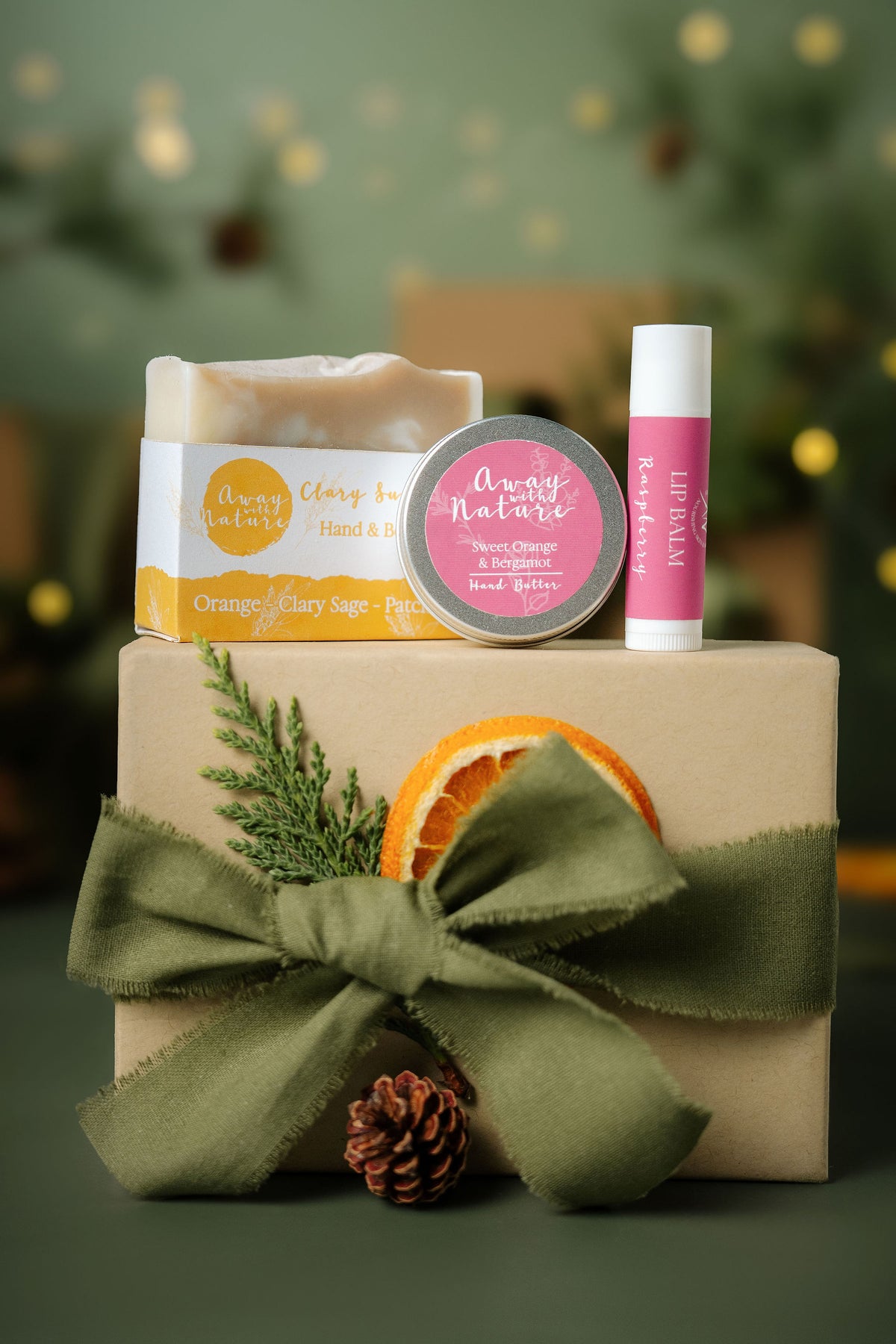 The Little Ritual Christmas gift set in Sweet Orange: Clary Sunshine hand and body bar, Sweet Orange and Bergamot hand butter and Raspberry lip balm by Away with Nature