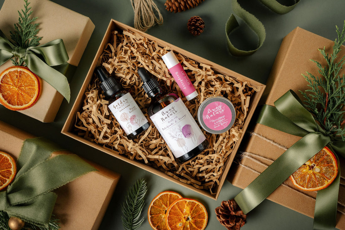 A Moment of Indulgence Christmas gift set by Away with Nature: Golden Facial Oil, Patchouli and Orange Body Oil, Sweet Orange and Bergamot Hand Butter and Raspberry Lip Balm